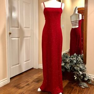 Backless shimmery red maxi dress.